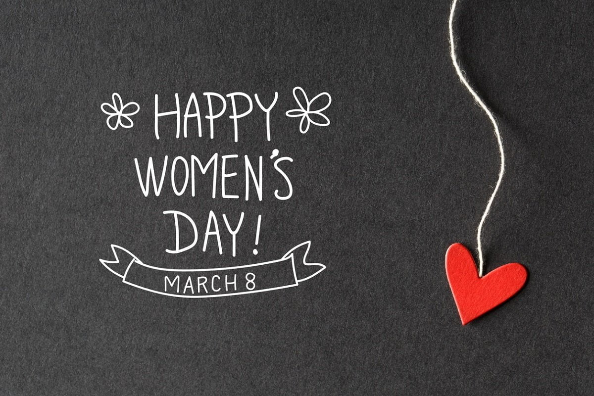 Happy Women's Day message with handmade small paper hearts